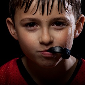 Young boy with athletic mouthguards