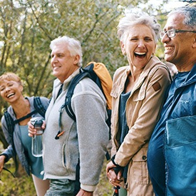 4 adults hiking together outside