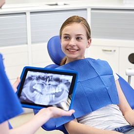 Young woman smiling in dental chair