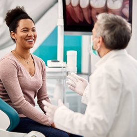 Patient and dentist discussing the cost of cosmetic dentistry in Arnold