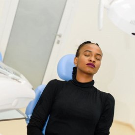 Relaxed dental patient with closed eyes