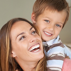 Mother and son smiling together