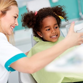 Little girl smiling in dental chair