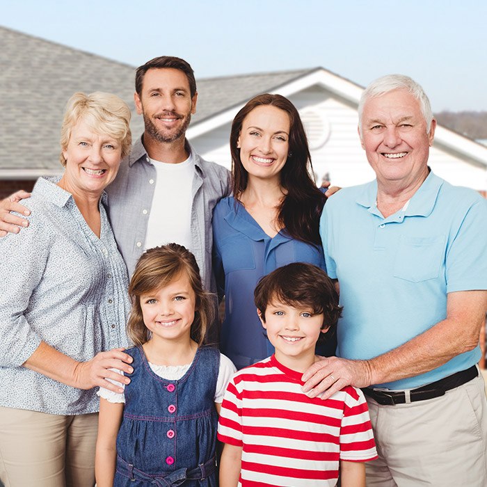 Three generations of a family smiling together