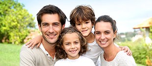 Smiling family of four