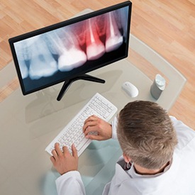 A dentist examining an x-ray