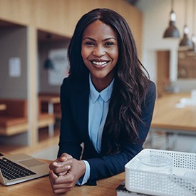 Businesswoman smiling with veneers in Arnold