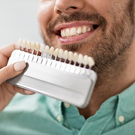 Man smiling during consultation for veneers in Arnold