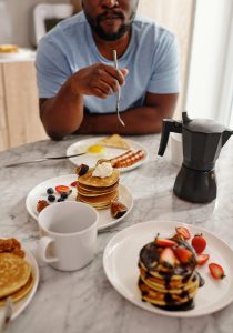 Man eating with dental implants in Norman