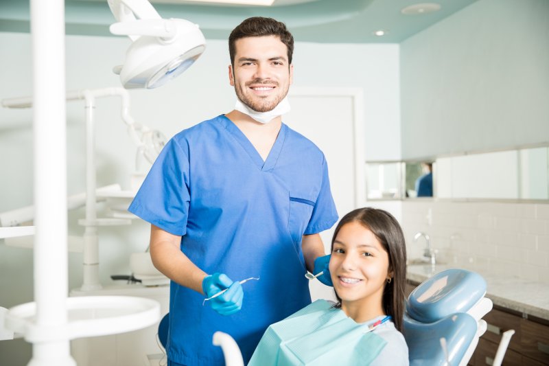 Smiling teen in a dentist chair